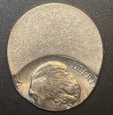 1940 Jefferson Nickel off-center strike error showing partial design and visible blank planchet arc
