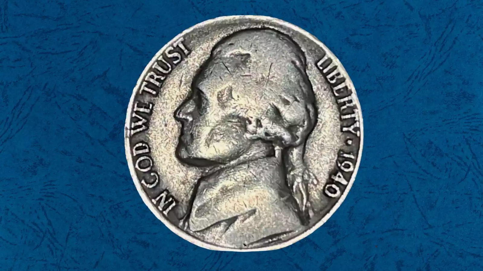 1940 Jefferson Nickel cud error showing raised mass of metal at rim where die break occurred